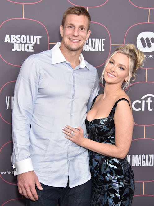 Tampa Bay Buccaneers tight end Robert Gronkowski and girlfriend Camille Kostek pose for a photo op o...