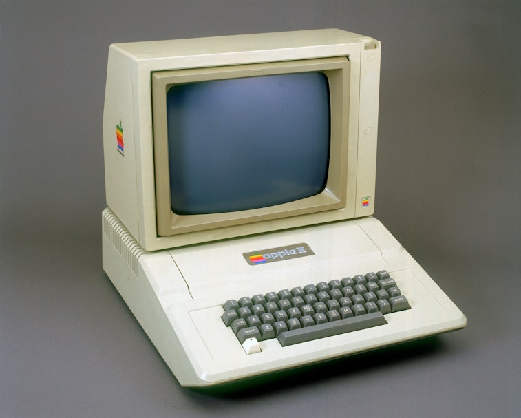 Apple II computer on a gray background.