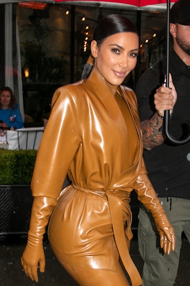 Kim Kardashian steps out in a latex body suit.