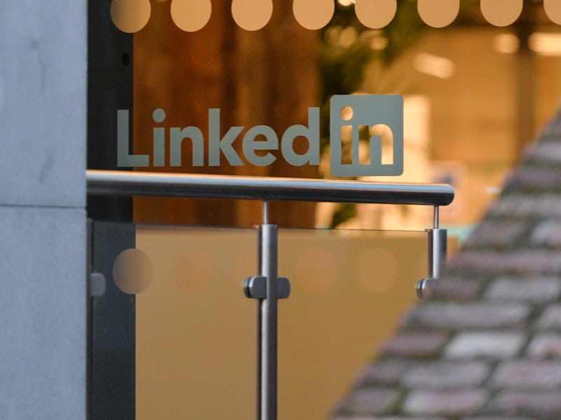 LinkedIn logo on a glass office door.