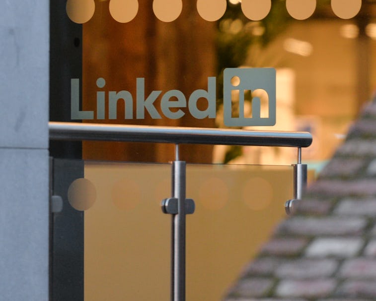 LinkedIn logo on a glass office door.