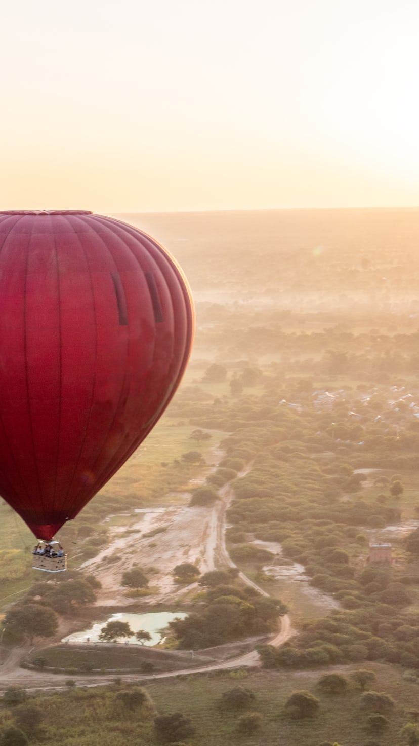 hot air balloon floating over a big field, meant to represent the author's ectopic kidney 
