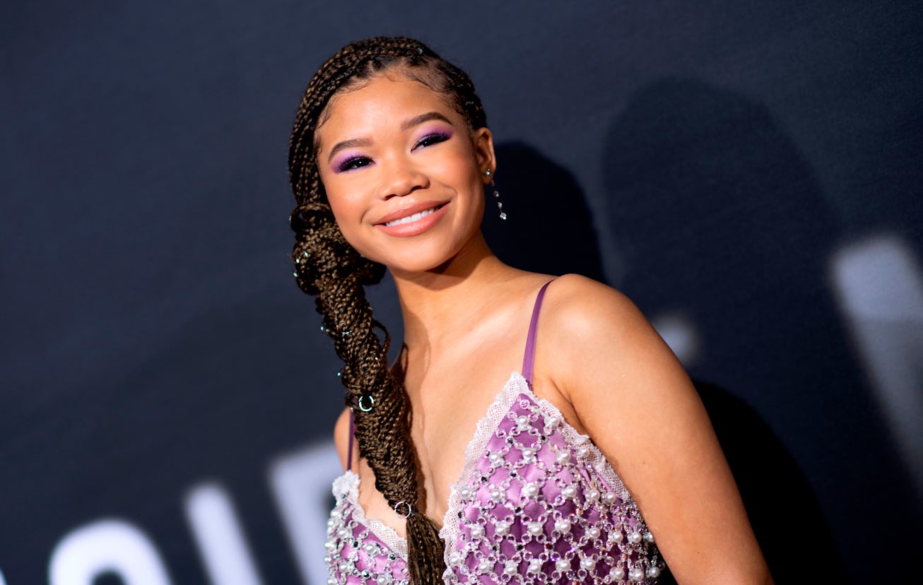Storm Reid in a purple, spaghetti strap dress