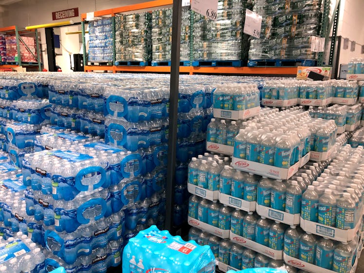 Palletes of packaged water and seltzer bottles.