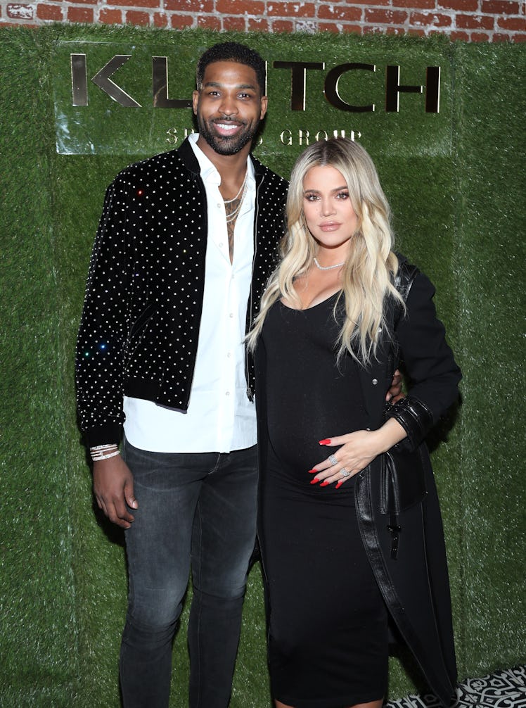 Tristan Thompson and Khloe Kardashian attend an event.