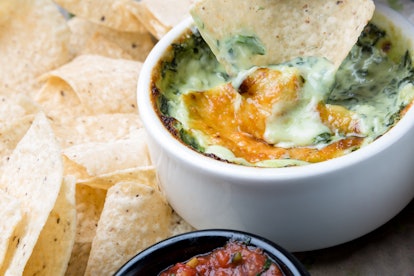Spinach and artichoke dip will pair perfectly with tortillas and your favorite beer.