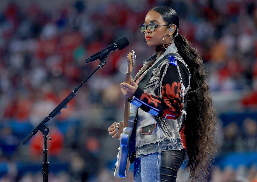 H.E.R. performs "America The Beautiful" before Super Bowl LV between the Tampa Bay Buccaneers and th...