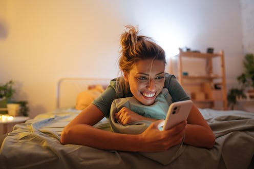 A woman videochats with her friends on Houseparty. what's the difference between houseparty and club...