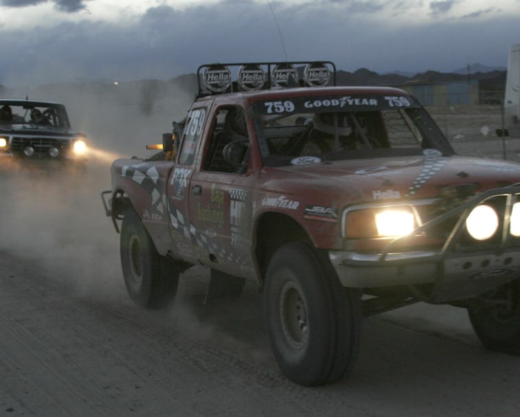 Pickup trucks racing at San Felipe 250 in Baja, California.