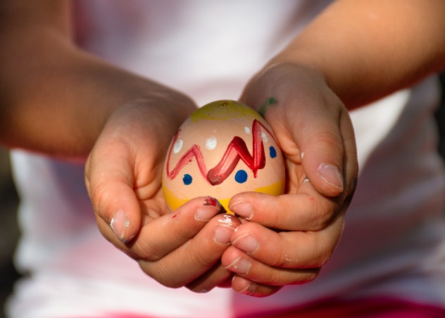 kid holding easter egg