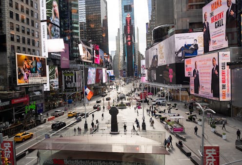 NEW YORK, NEW YORK - NOVEMBER 03: People visit Times Square as the city continues the re-opening eff...