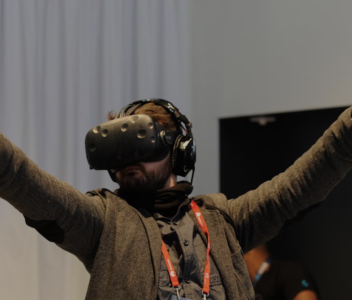 A visitor tests the Vive virtual reality glasses by HTC at the Mobile World Congress in Barcelona, S...