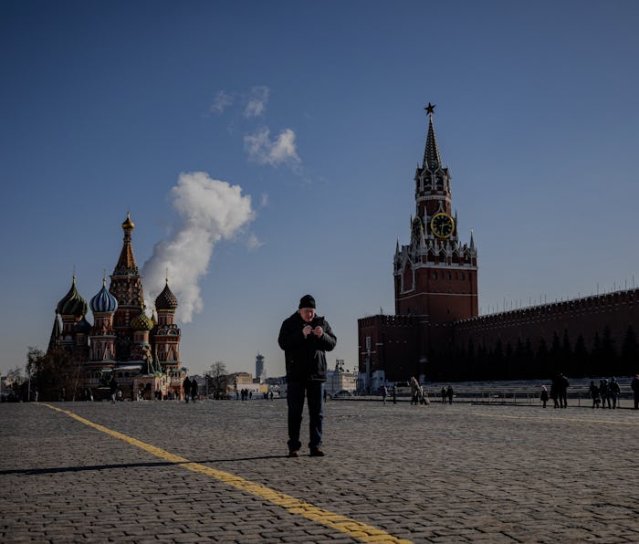 A man uses his mobile phone on Red Square in downtown Moscow on March 10, 2021. - Russia said on Mar...