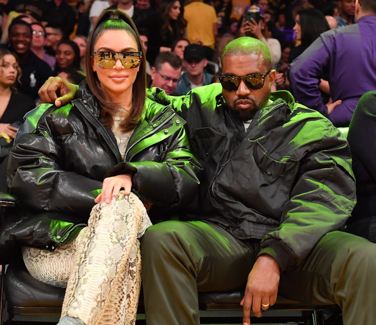 LOS ANGELES, CALIFORNIA - JANUARY 13: Kim Kardashian and Kanye West attend a basketball game between...