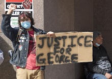 WASHINGTON, March 9, 2021 -- Protestors are seen outside the Hennepin County courthouse in Minneapol...