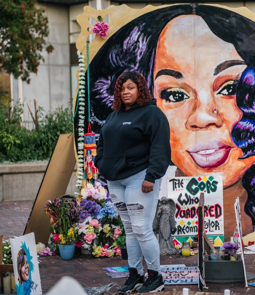Tamika Palmer, mother of Breonna Taylor, poses for a portrait in front of a mural of her daughter at...