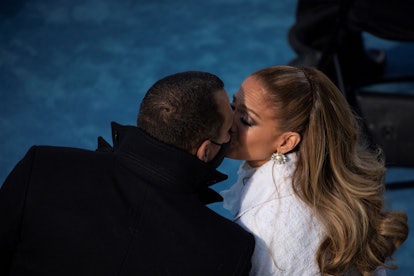 Jennifer Lopez (R) kisses fiancé Alex Rodriguez (L) after performing during the inauguration of Joe ...