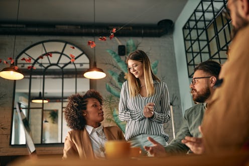 Group of colleagues having a meeting at a cafe