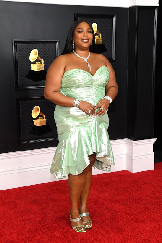 Lizzo wearing a custom Balmain mini dress to the 2021 Grammys. 