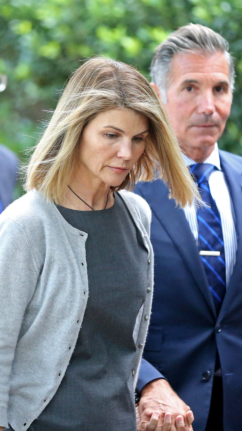 BOSTON MA. - AUGUST 27:  Actress Lori Loughlin and her husband Mossimo Giannulli leave Moakley Feder...