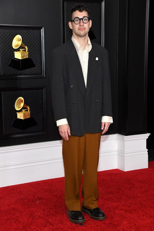 Jack Antonoff wore a black suit jacket and brown trousers to the 2021 Grammys.