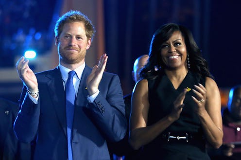 ORLANDO, FL - MAY 08:  Prince Harry and Michelle Obama cheer during the Opening Ceremony of the Invi...