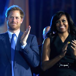 ORLANDO, FL - MAY 08:  Prince Harry and Michelle Obama cheer during the Opening Ceremony of the Invi...