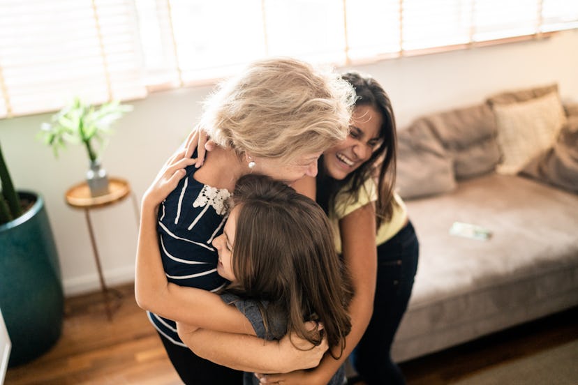 mom and daughters hug on mother's day