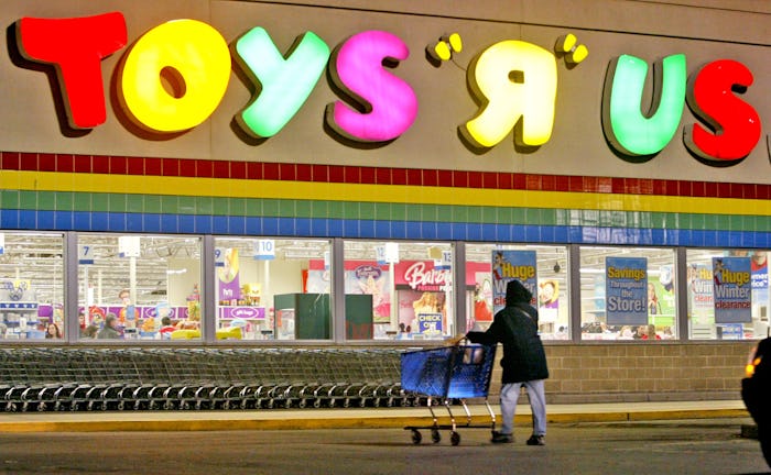 1/6/06 - BOSTON, MA - A shopper passes in front of Toys R Us in the South Bay Shopping Plaza Frida...