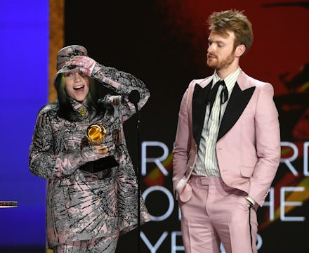 LOS ANGELES, CALIFORNIA - MARCH 14: (L-R) Billie Eilish and FINNEAS accept the Record of the Year aw...