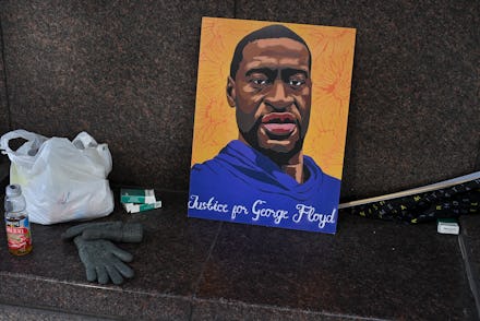 MINNEAPOLIS, MN - MARCH 11: A rendering of George Floyd sits on a bench across from the Hennepin Cou...