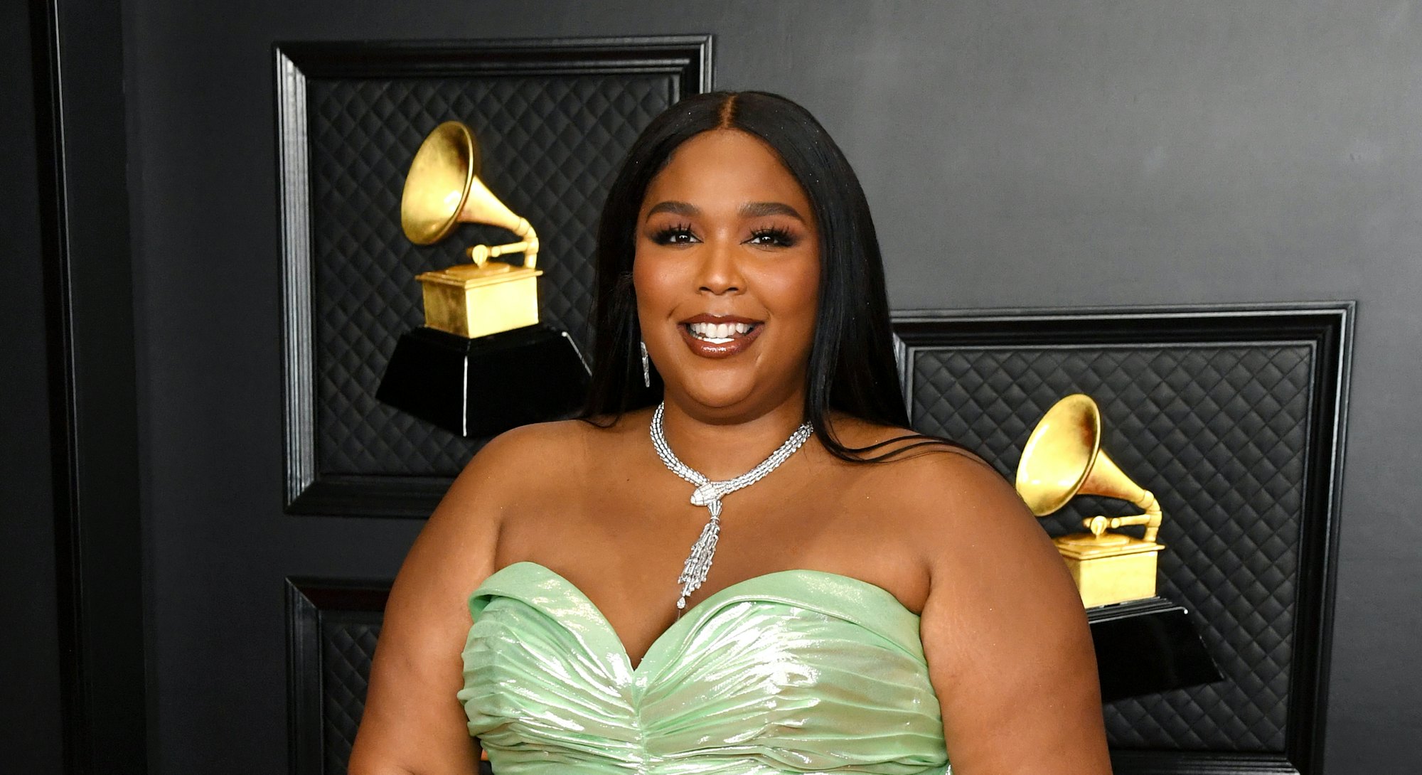 Lizzo wearing custom Balmain at the 2021 Grammys.