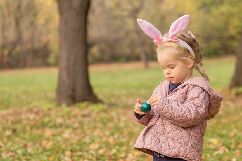 little girl easter bunny ears, wondering "is the Easter bunny real?"