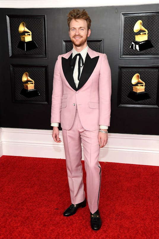 Finneas wearing a Gucci pink suit to the 2021 Grammys.