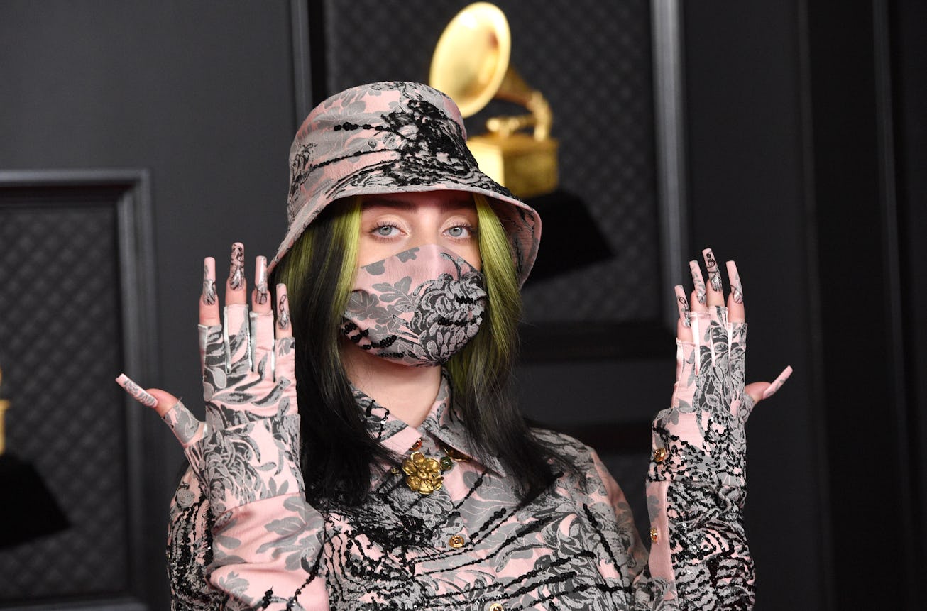 Billie Eilish shows off her manicure on the Grammys red carpet