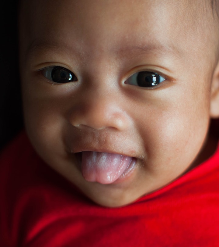 Baby sticking its tongue out, in a story answering the question, why do babies stick their tongue ou...