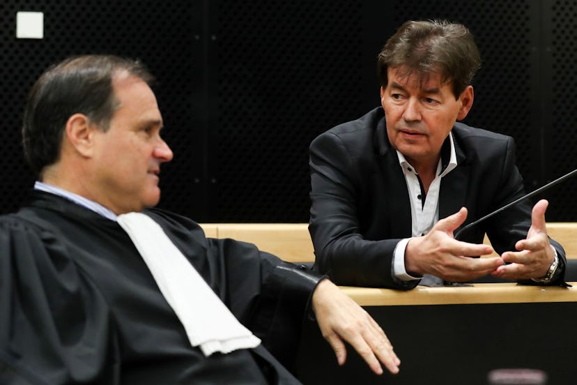 Former Belgian politician Bernard Wesphael (R) speaks to his lawyer Jean-Philippe Mayence at the sta...