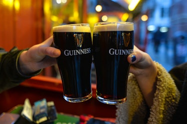 People enjoy a pint of Guinness on a bar-restaurant terasse in Dublin's city center.
On Wednesday, D...
