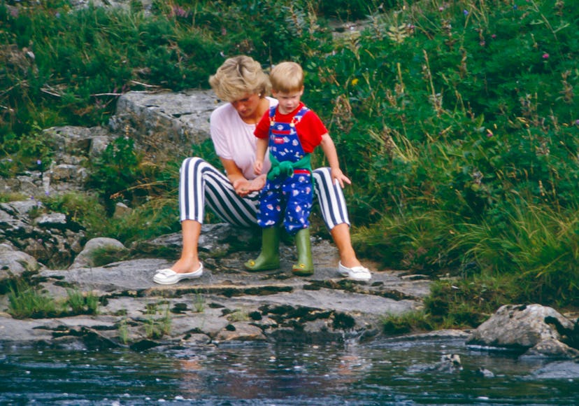 Princess Diana at the river in Balmoral with Prince Harry.