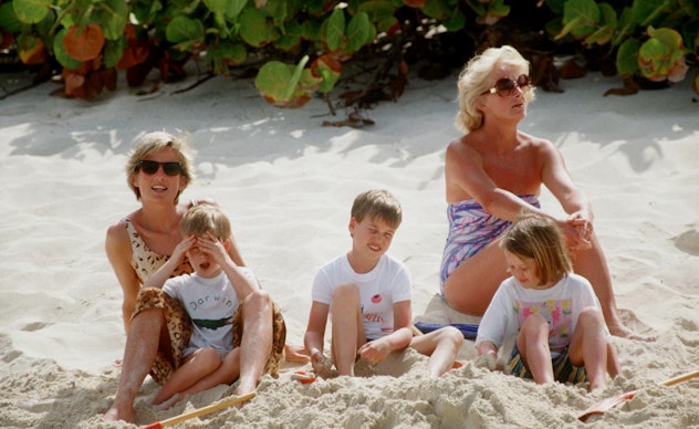 Princess Diana on the beach with her family.