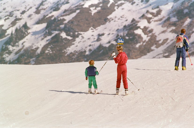 Princess Diana helps Prince Harry ski.