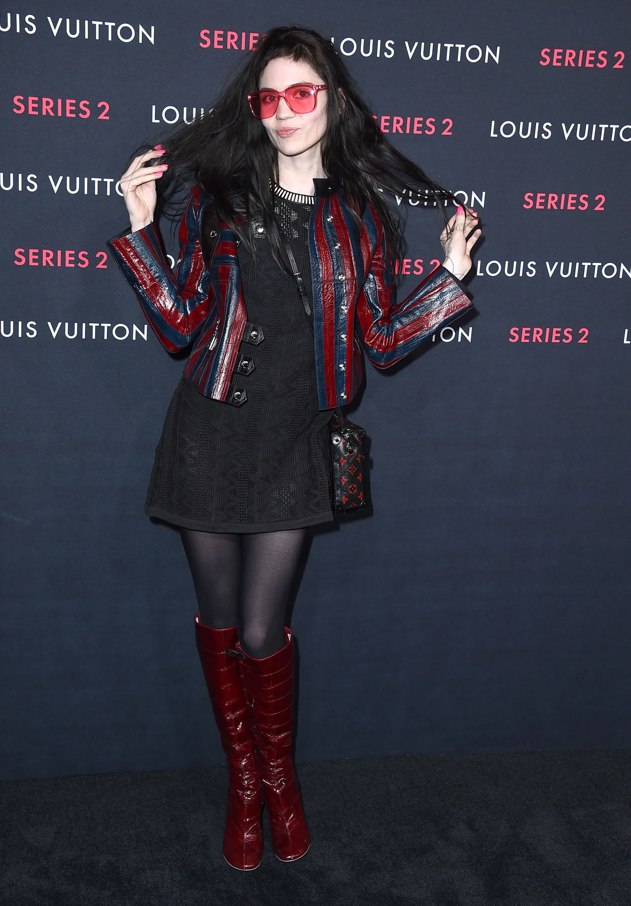 grimes red dress Elon Musk and Grimes on vacation with their kids: Are they back together?