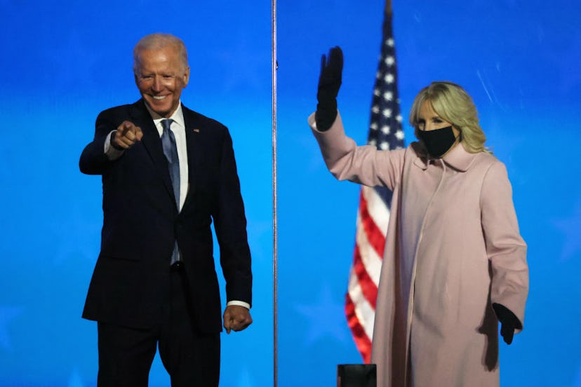 Jill Biden, wearing a pink Hiso coat, waves as her husband Democratic presidential nominee Joe Biden...