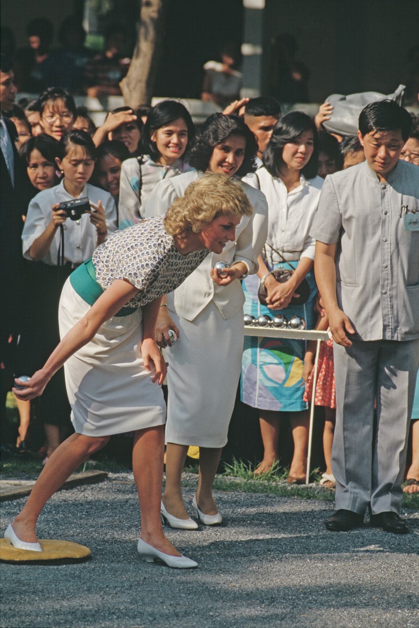 Princess Diana plays pétanque in Thailand in 1988.