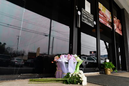 ACWORTH, GA - MARCH 17: Flowers are seen outside a massage parlor where four people were shot and ki...