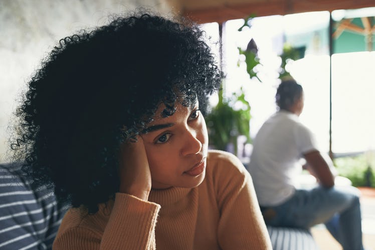 Shot of a young woman looking upset after an argument with her partner at home