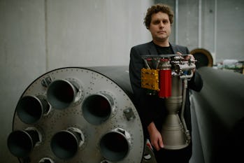 AUCKLAND, NEW ZEALAND - JUNE 10: RocketLab CEO, Peter Beck poses with The Rutherford at the company's Auckland headquarters on June 10, 2015 in Auckland, New Zealand. The Rutherford, a battery-powered rocket engine printed on 3D parts developed by New Zealand space technology company, RocketLab, is set to reduce the cost for companies to send satellites to space by as much as US$5-45 million. Test flights will begin this year with a goal to provide commercial launch operations by 2016. (Photo by Phil Walter/Getty Images)