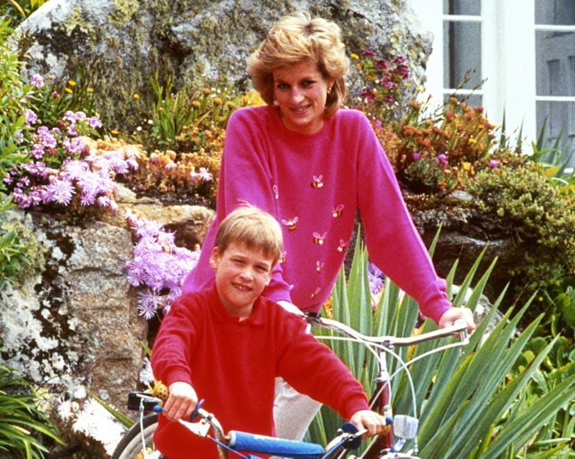 Diana, Princess of Wales with son Prince William, prepare for a cycling trip in Tresco during their ...