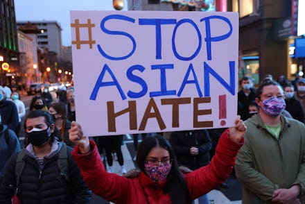 WASHINGTON, DC - MARCH 17: Activists participate in a vigil in response to the Atlanta spa shootings...