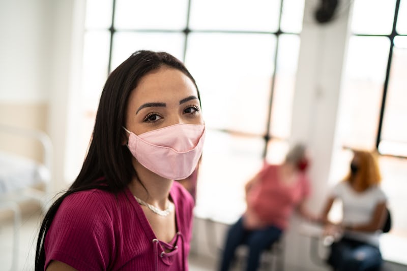 Doctors explain how long you'll be wearing your face mask for as COVID vaccines roll out.